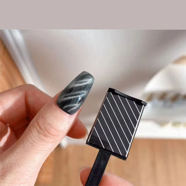 Magnet over magnetic gel or nail polish with diagonal stripes pattern